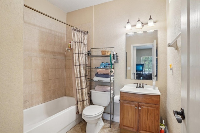 3721 S Lake Orlando Pkwy Unit 05, Orlando, FL 32808 - bathroom featuring toilet, shower / bath combo with shower curtain, a textured wall, vanity, and tile patterned floors