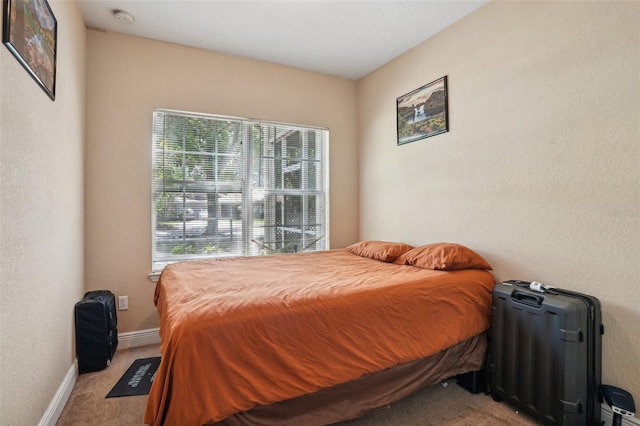 3721 S Lake Orlando Pkwy Unit 05, Orlando, FL 32808 - bedroom featuring light carpet and baseboards