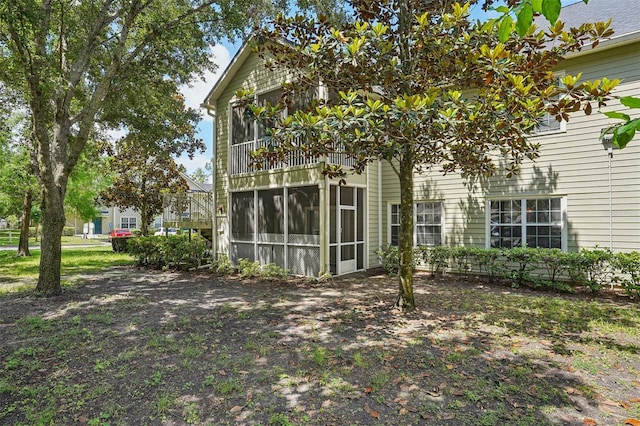 3721 S Lake Orlando Pkwy Unit 05, Orlando, FL 32808 - back of house with a sunroom