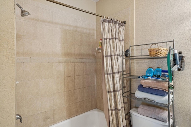 3721 S Lake Orlando Pkwy Unit 05, Orlando, FL 32808 - bathroom featuring a textured wall, shower / tub combo with curtain, and toilet