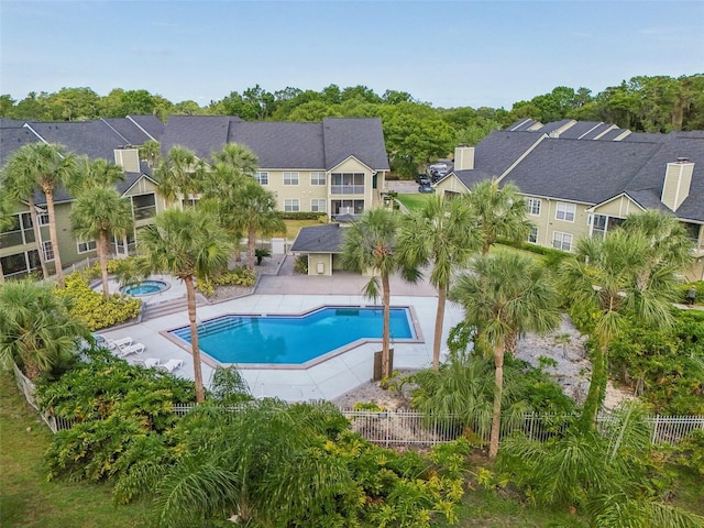 3721 S Lake Orlando Pkwy Unit 05, Orlando, FL 32808 - community pool with a community hot tub, a residential view, and fence