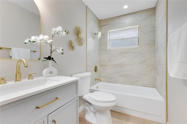 full bathroom featuring toilet, vanity, bathing tub / shower combination, and wood finished floors