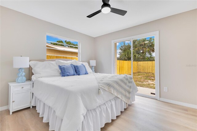 bedroom with access to exterior, light wood-style floors, baseboards, and ceiling fan