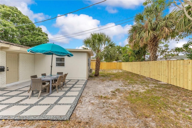 fenced backyard featuring a patio
