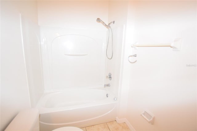 full bath with tile patterned flooring,  shower combination, and baseboards