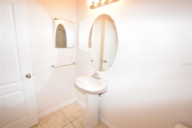 bathroom featuring tile patterned flooring and baseboards