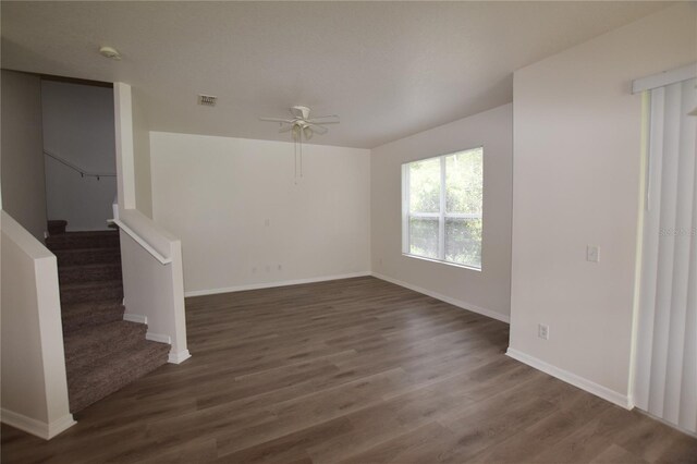 15349 Oak Apple Ct, Winter Garden, FL 34787 - unfurnished room with a ceiling fan, dark wood-style floors, stairs, and baseboards