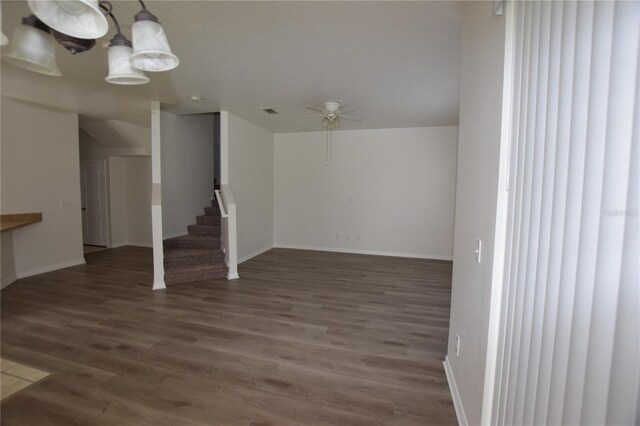 15349 Oak Apple Ct, Winter Garden, FL 34787 - unfurnished living room with ceiling fan, wood finished floors, stairs, and baseboards