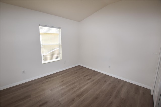 15349 Oak Apple Ct, Winter Garden, FL 34787 - unfurnished room featuring dark wood-style flooring, vaulted ceiling, and baseboards