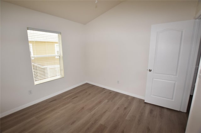 15349 Oak Apple Ct, Winter Garden, FL 34787 - spare room with vaulted ceiling, wood finished floors, and baseboards