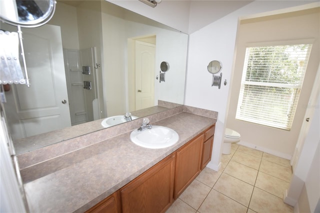 15349 Oak Apple Ct, Winter Garden, FL 34787 - full bathroom with toilet, vanity, tile patterned flooring, baseboards, and a shower