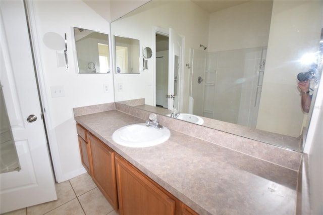 15349 Oak Apple Ct, Winter Garden, FL 34787 - bathroom with vanity, tile patterned floors, and a shower