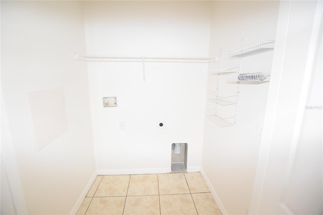 15349 Oak Apple Ct, Winter Garden, FL 34787 - washroom with hookup for an electric dryer, washer hookup, light tile patterned floors, and baseboards