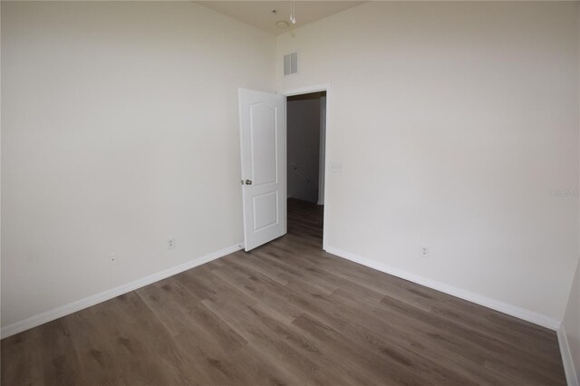 15349 Oak Apple Ct, Winter Garden, FL 34787 - empty room with baseboards, wood finished floors, and a high ceiling