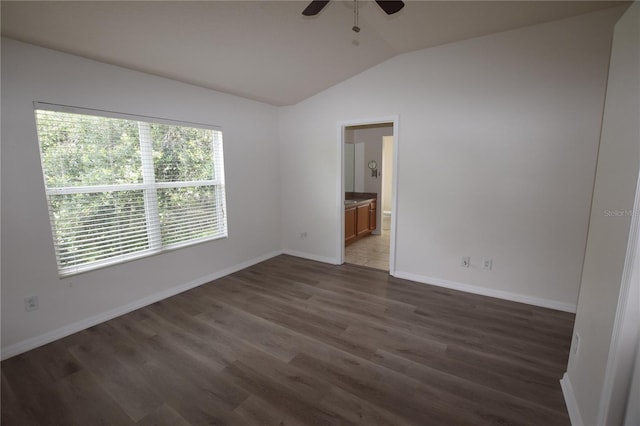 15349 Oak Apple Ct, Winter Garden, FL 34787 - spare room featuring lofted ceiling, a ceiling fan, wood finished floors, and baseboards