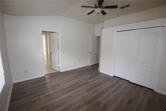 15349 Oak Apple Ct, Winter Garden, FL 34787 - unfurnished bedroom featuring wood finished floors, vaulted ceiling, a closet, baseboards, and ceiling fan