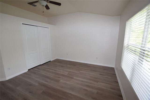 15349 Oak Apple Ct, Winter Garden, FL 34787 - unfurnished bedroom with lofted ceiling, wood finished floors, baseboards, a closet, and ceiling fan