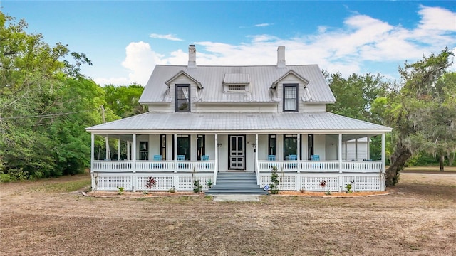 511 E Mirror Lake Dr, Fruitland Park, FL 34731 - view of front of home with a porch and a chimney
