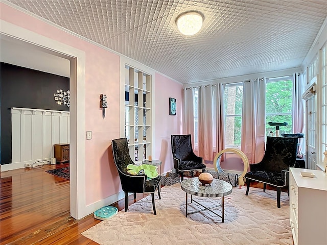 511 E Mirror Lake Dr, Fruitland Park, FL 34731 - sitting room with crown molding, plenty of natural light, wood finished floors, and baseboards