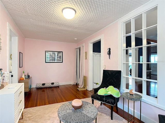 511 E Mirror Lake Dr, Fruitland Park, FL 34731 - living area with wood finished floors, baseboards, and crown molding