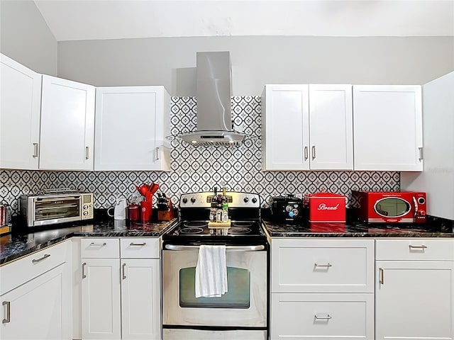 511 E Mirror Lake Dr, Fruitland Park, FL 34731 - kitchen featuring stainless steel range with electric cooktop, wall chimney exhaust hood, white cabinets, decorative backsplash, and dark stone countertops