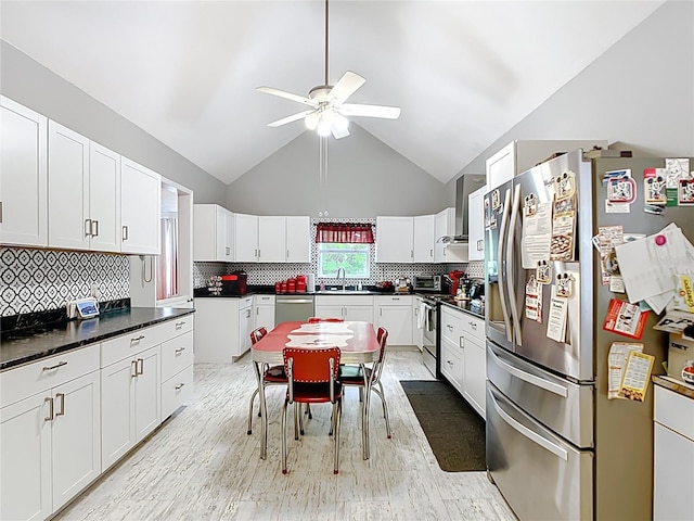 511 E Mirror Lake Dr, Fruitland Park, FL 34731 - kitchen featuring appliances with stainless steel finishes, a ceiling fan, a sink, high vaulted ceiling, and white cabinetry