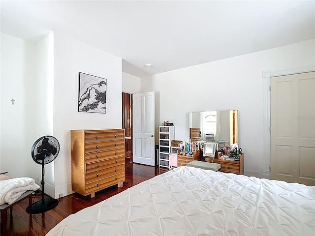 511 E Mirror Lake Dr, Fruitland Park, FL 34731 - bedroom with dark wood-style flooring