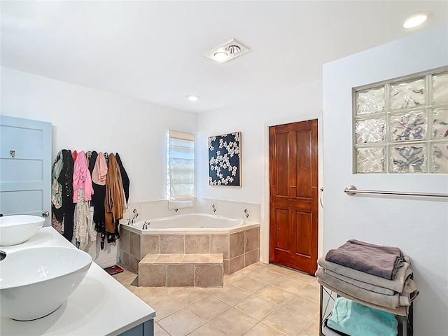 511 E Mirror Lake Dr, Fruitland Park, FL 34731 - full bath featuring a garden tub, a sink, and tile patterned floors