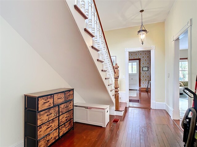 511 E Mirror Lake Dr, Fruitland Park, FL 34731 - entryway with dark wood-style floors, stairway, and baseboards
