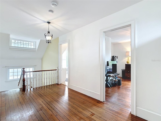 511 E Mirror Lake Dr, Fruitland Park, FL 34731 - additional living space with hardwood / wood-style floors, baseboards, and an office area