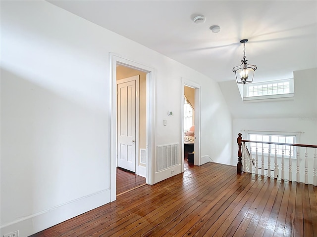 511 E Mirror Lake Dr, Fruitland Park, FL 34731 - bonus room with hardwood / wood-style flooring and a chandelier