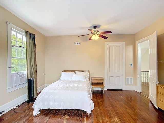 511 E Mirror Lake Dr, Fruitland Park, FL 34731 - bedroom with wood-type flooring, baseboards, and cooling unit