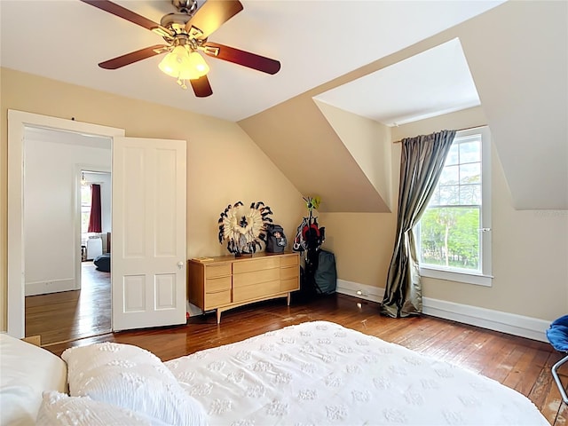511 E Mirror Lake Dr, Fruitland Park, FL 34731 - bedroom with hardwood / wood-style floors, vaulted ceiling, ceiling fan, and baseboards
