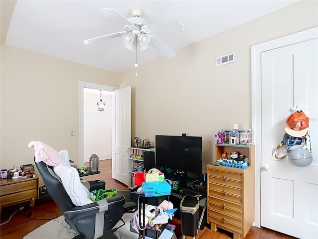 511 E Mirror Lake Dr, Fruitland Park, FL 34731 - bedroom featuring wood finished floors and ceiling fan