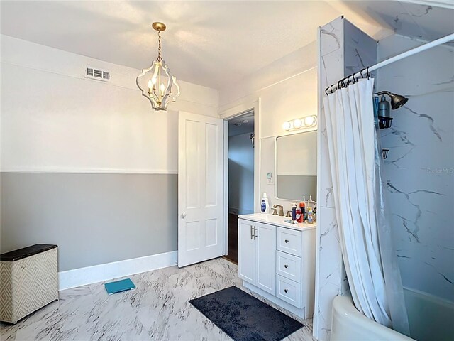 511 E Mirror Lake Dr, Fruitland Park, FL 34731 - full bath featuring marble look tiles, vanity, shower / bath combo, and a chandelier