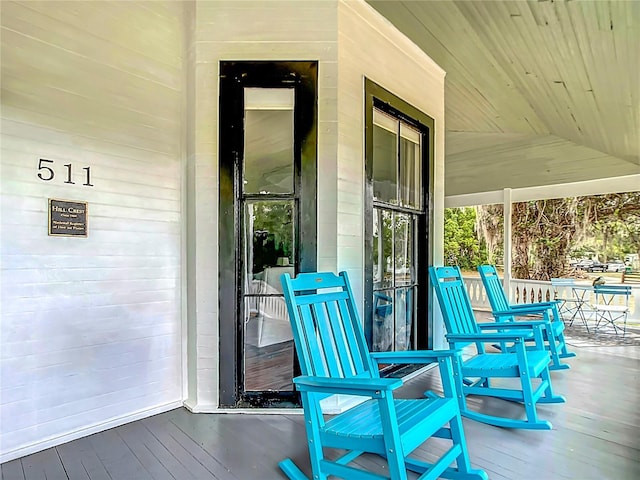 511 E Mirror Lake Dr, Fruitland Park, FL 34731 - wooden terrace featuring covered porch