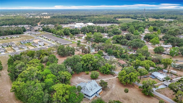 511 E Mirror Lake Dr, Fruitland Park, FL 34731 - aerial view of residential area with a heavily wooded area