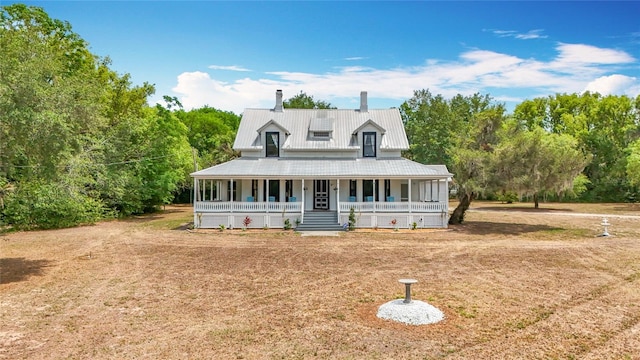 511 E Mirror Lake Dr, Fruitland Park, FL 34731 - view of front of home featuring a porch and a chimney