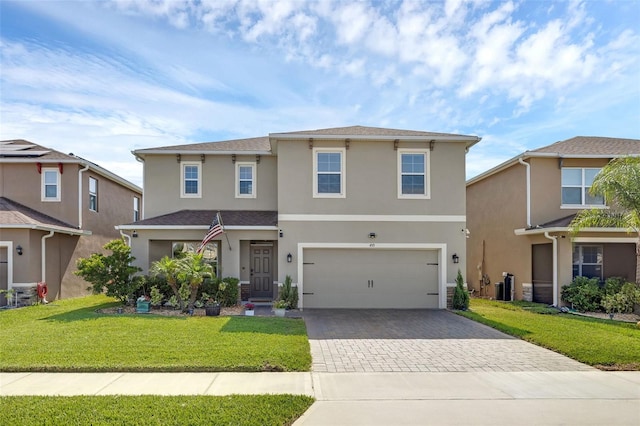455 Lazio Cir, Debary, FL 32713 - traditional-style home featuring driveway, stucco siding, a front lawn, an attached garage, and central AC