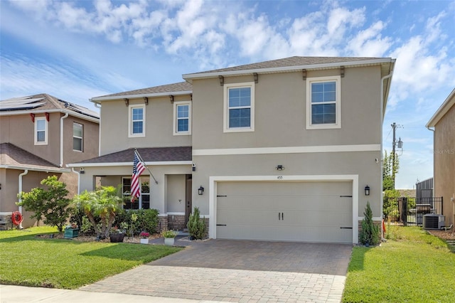 455 Lazio Cir, Debary, FL 32713 - view of front facade with driveway, central air condition unit, stucco siding, a shingled roof, and an attached garage