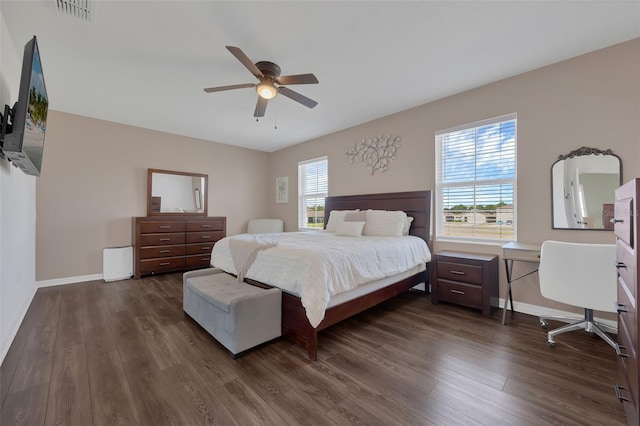 455 Lazio Cir, Debary, FL 32713 - bedroom with dark wood-style floors, baseboards, and ceiling fan