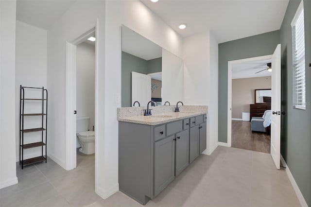 455 Lazio Cir, Debary, FL 32713 - ensuite bathroom featuring ceiling fan, tile patterned floors, and baseboards