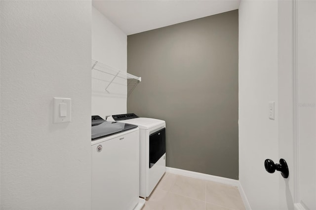 455 Lazio Cir, Debary, FL 32713 - washroom featuring washing machine and dryer, light tile patterned floors, and baseboards