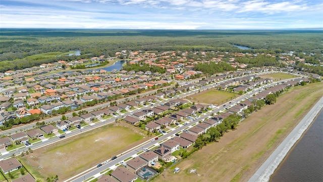 455 Lazio Cir, Debary, FL 32713 - aerial view of property and surrounding area featuring nearby suburban area, a large body of water, and a forest