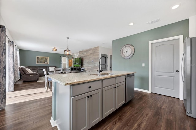 455 Lazio Cir, Debary, FL 32713 - kitchen featuring a sink, appliances with stainless steel finishes, open floor plan, dark wood-style floors, and gray cabinetry
