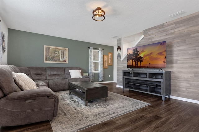 455 Lazio Cir, Debary, FL 32713 - living area featuring an accent wall, wood walls, wood finished floors, and baseboards