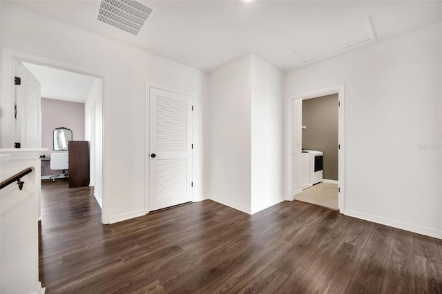 455 Lazio Cir, Debary, FL 32713 - empty room with dark wood-type flooring, baseboards, and washer / dryer