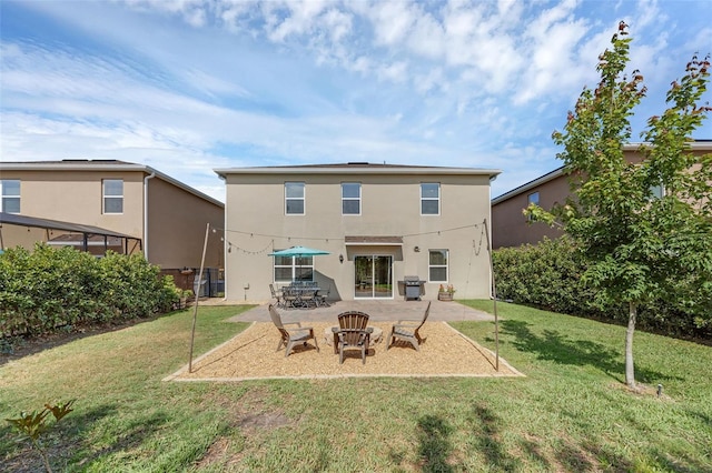 455 Lazio Cir, Debary, FL 32713 - back of property with a patio, a yard, and stucco siding