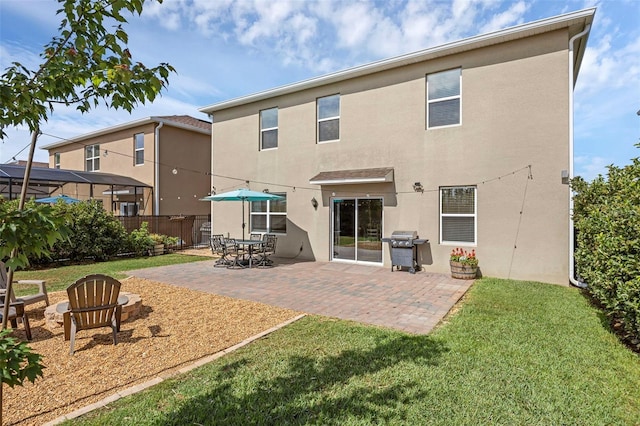 455 Lazio Cir, Debary, FL 32713 - back of property with stucco siding and a patio area