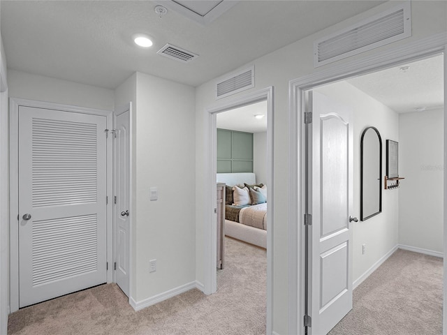 1562 Dalehurst Ln, Kissimmee, FL 34744 - corridor with light colored carpet and baseboards
